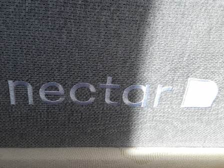 Nectar logo on side of hybrid mattress